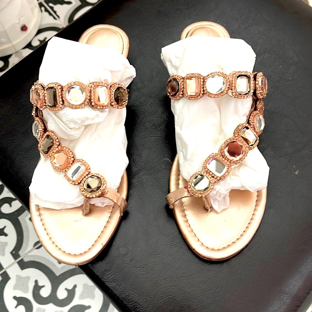 Vince Camuto rose gold sandals with large gemstones.